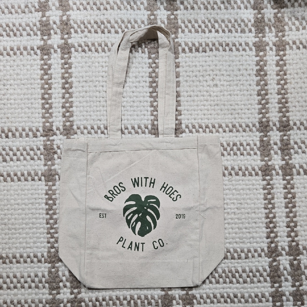 Bros Wirh Hoes Plant Co. Canvas Tote Bag with Green Monstera Leaf Design